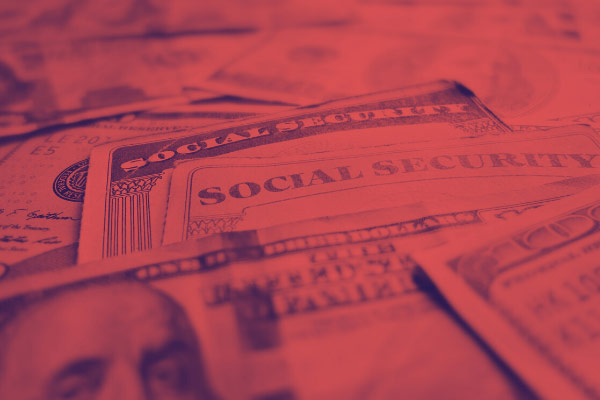 red tinted social security cards and money