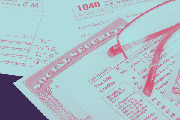 glasses, social security card, and tax sheets